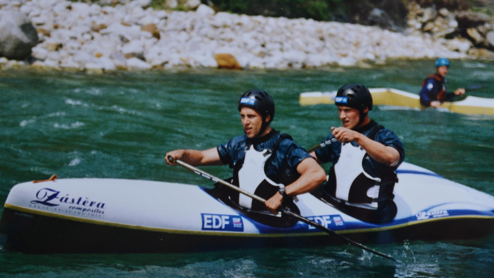 Remi, at the front, kayaking