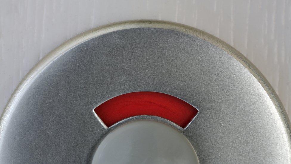 Close-up of a bathroom door lock