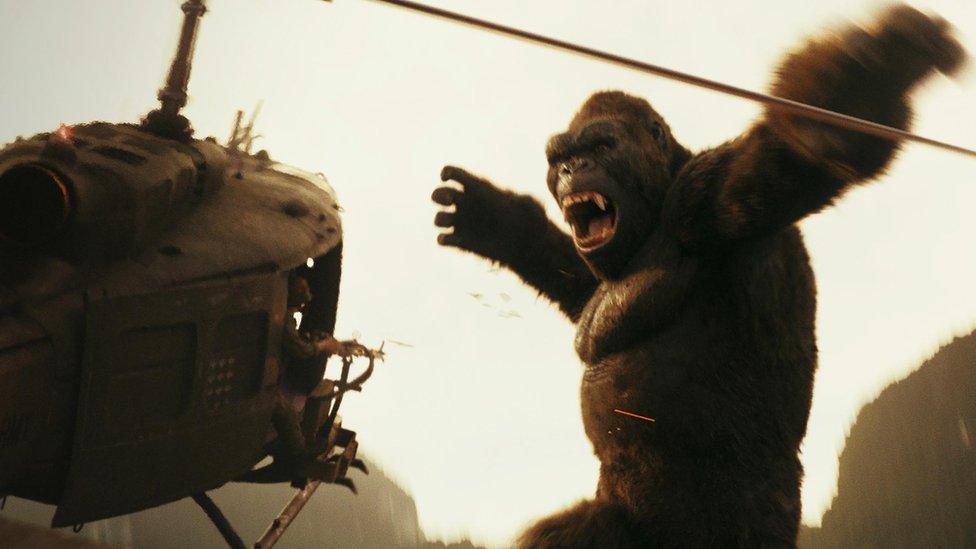 Kong coming face to face with a helicopter