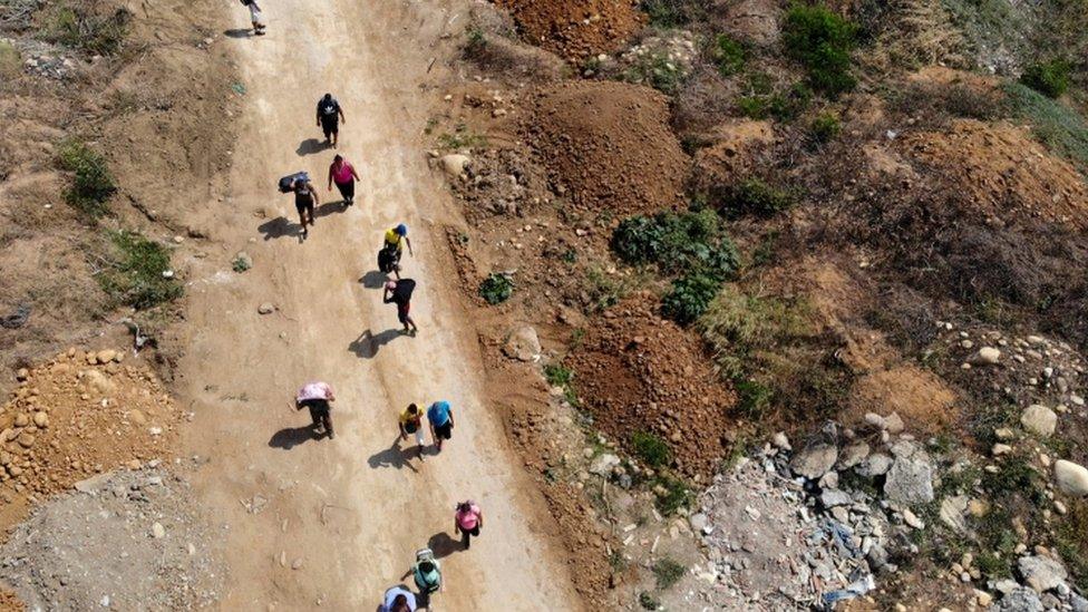 Venezuelans overwhelmed by daily hardships in their crisis-torn country have turned into scrap merchants, embarking in processions along clandestine trails