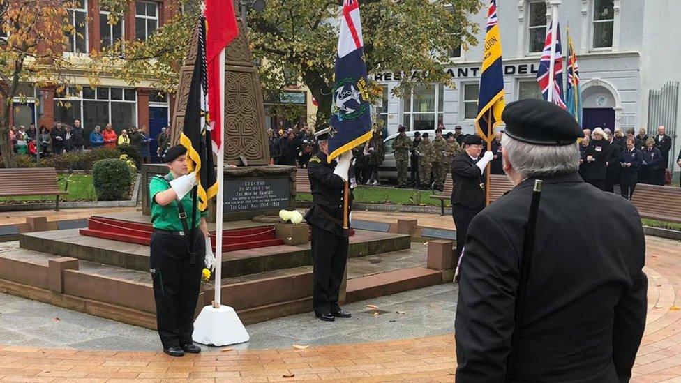 Ex-serviceman standing in front of Ramsey war memorial