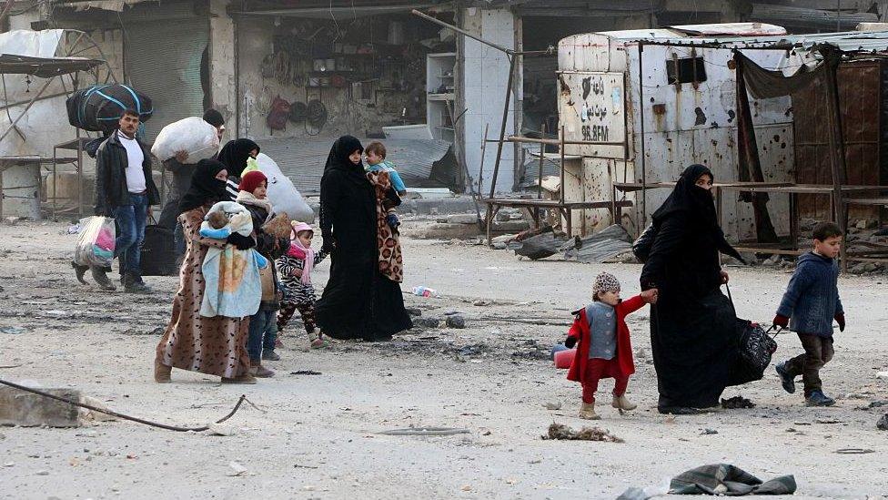 Residents escape Assad regime bombardment in Al Moyaser neighbourhood of Aleppo, Syria on 29 November 2016