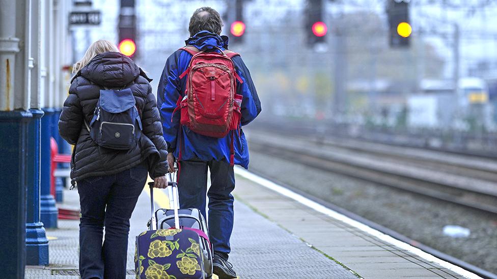 Passengers wait to board an Avanti West Coast mainline train at Crewe Station on December 01, 2022 in Crewe, England