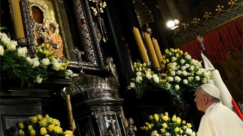 Pope Francis looks at the Black Madonna relic