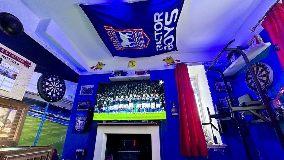 Ipswich Town memorabilia and including a flag on the ceiling