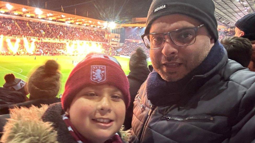 Waseem Zaffar with his son at the game