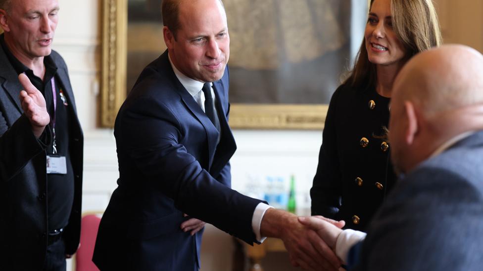 The Prince and Princess of Wales meet people who helped facilitate the committal service in Windsor