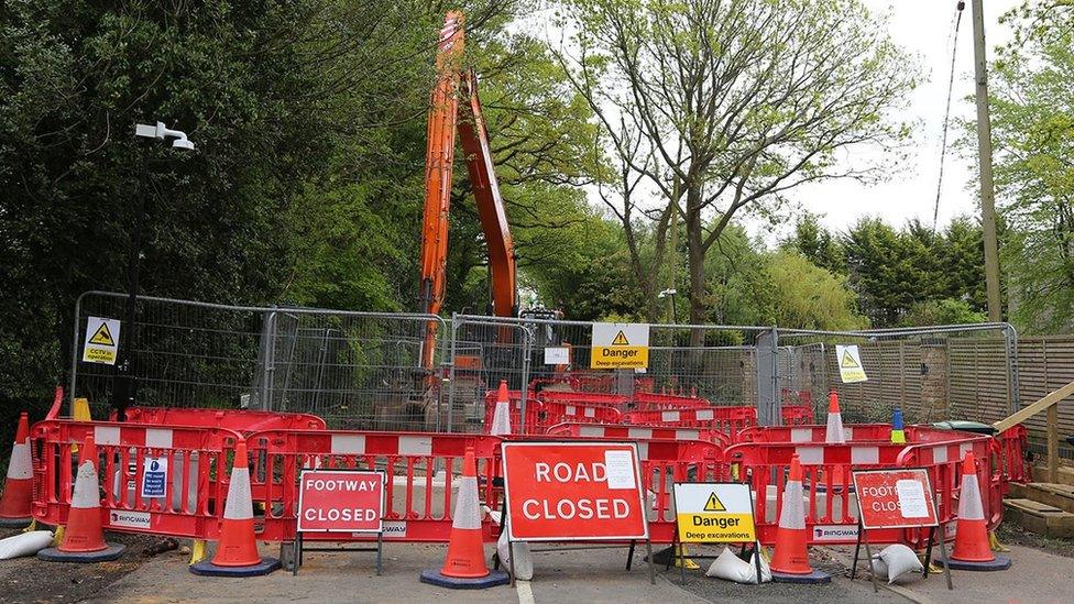 Barriers and signs around a sinkhole