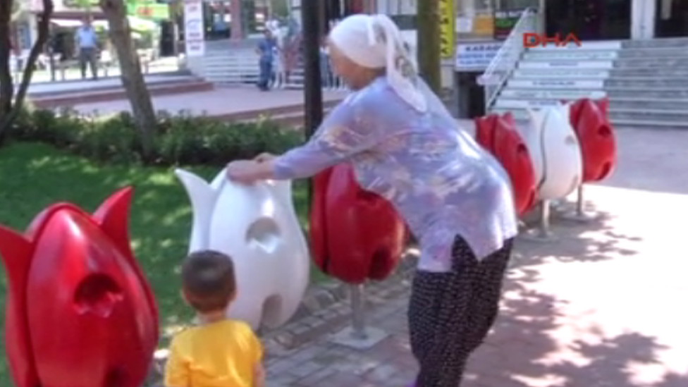 A woman and a little boy using one of the new seats