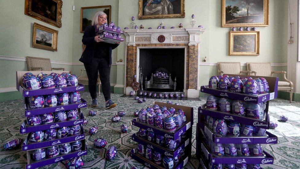 Claire Grant from the National Trust for Scotland with a pile of Easter eggs in the Drawing Room at the National Trust's Georgian House in Edinburgh