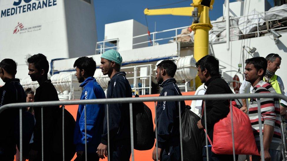 Migrants disembark at the port of Catania, Sicily on May 10, 2018