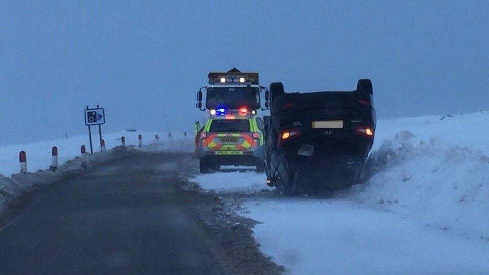 Car on its roof on A82 in the Highlands