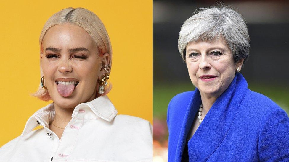 composite image shows anne marie on one side sticking her tongue out and winking and theresa may in a professional portrait on the other