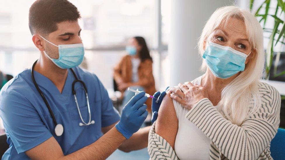 Woman being vaccinated