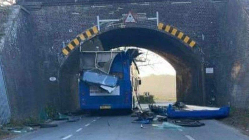 Bus crashes into bridge