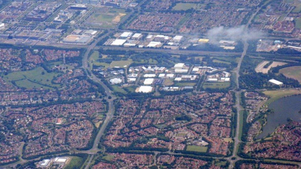 Industrial and housing estates. The main road across the image is the A5 [Watling Street]; below it, at the RH edge, is part of The National Bowl and Furzton Lake.