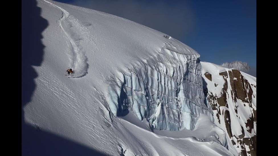 Eduardo Blanchard carving past a pristine serac (ice cliff) on the Petit Envers.