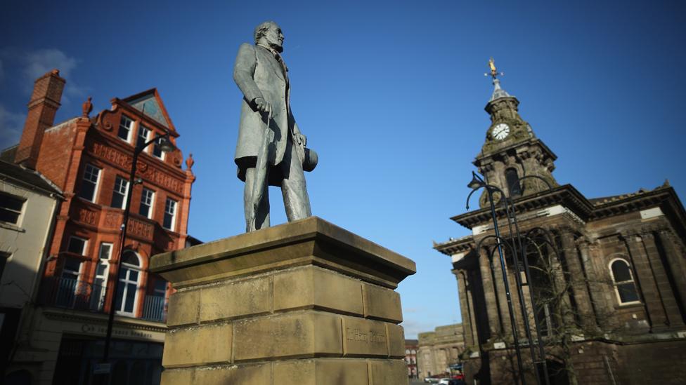 A statue of Sir Henry Doulton, founder of Royal Doulton China, overlooks Burslem on February 4, 2015 in Burslem, Stoke-on-Trent,