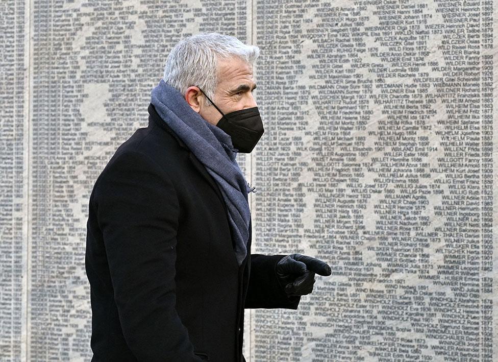 Israel's Foreign Minister Yair Lapid visits the Wall of Names Memorial in the Ostarrichi Park in Vienna, Austria on 27 January 2022