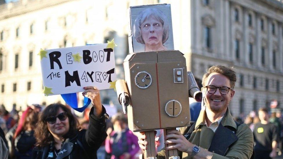 Anti-Brexit campaigners take part in the People"s Vote march