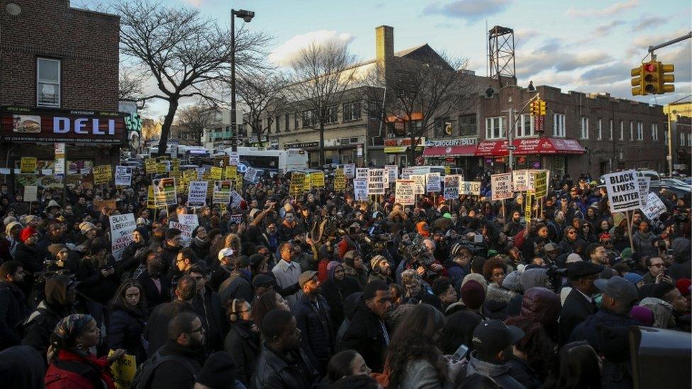 Hundreds marched from the shooting site to the police station