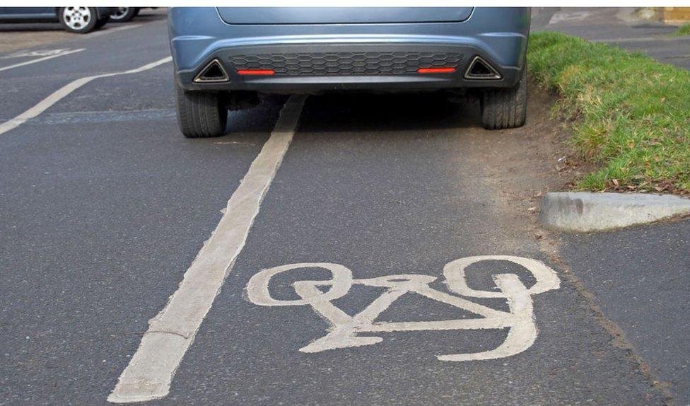 Car in bike lane