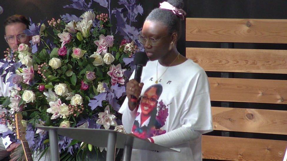 Elianne's aunt Sylvia reading a eulogy