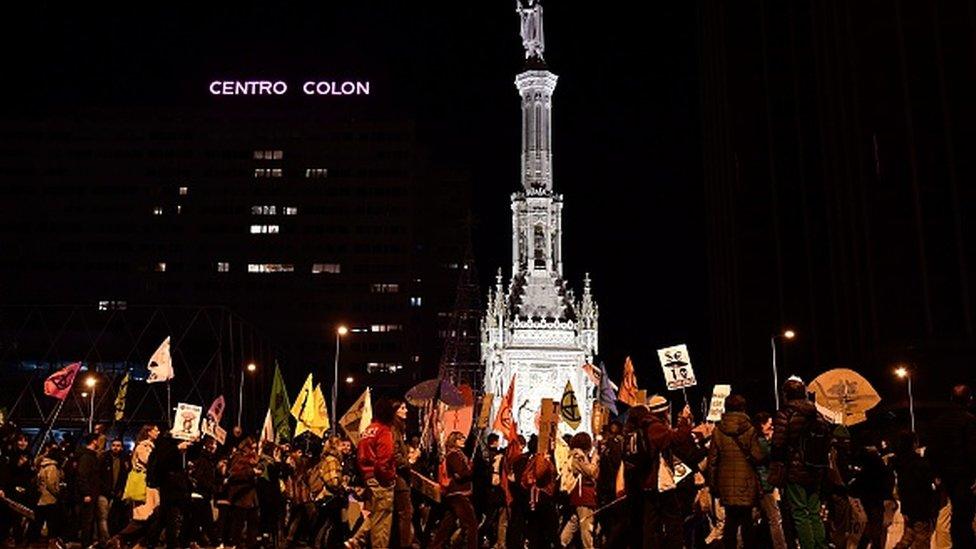 Demonstrators take part in a mass climate march