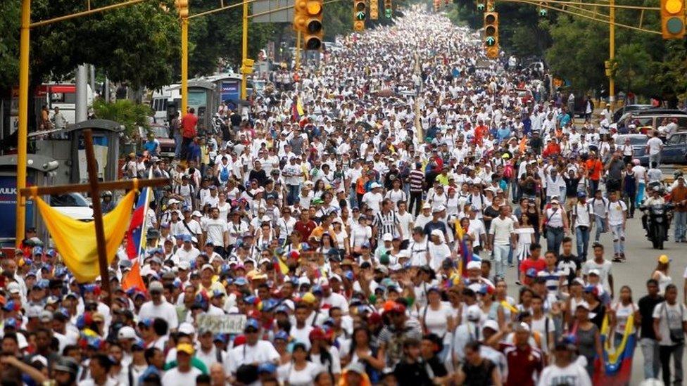 Demonstrators during a protest against Venezuela's President Nicolas Maduro"s government in Caracas 22 April 2017