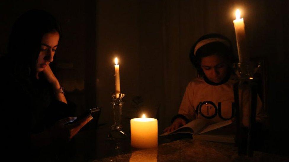 People light candles amid scorching summer heat as power outage crisis hit Tehran