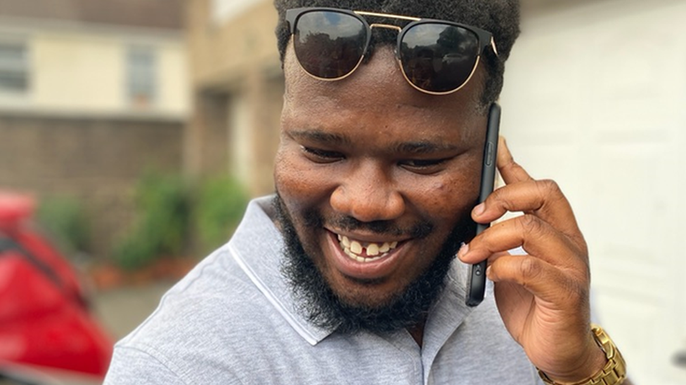 Freddie Fontente Jones smiling while talking on a mobile phone