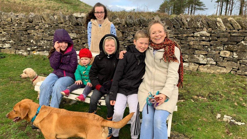 Jess with her five children and two dogs