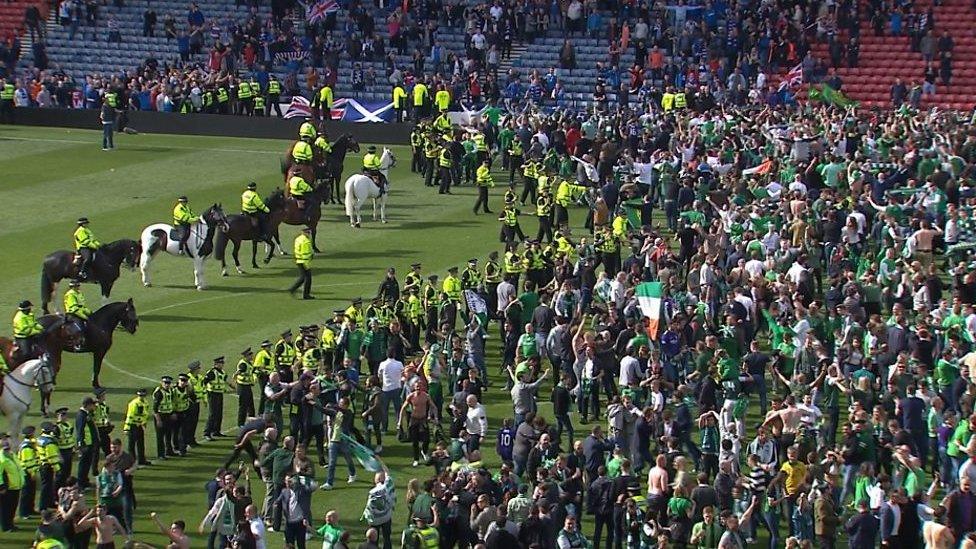 Fans and police in Hampden Park