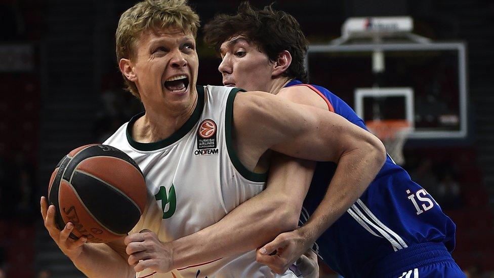 Mindaugas Kuzminskas playing basketball for the Malaga club in Spain