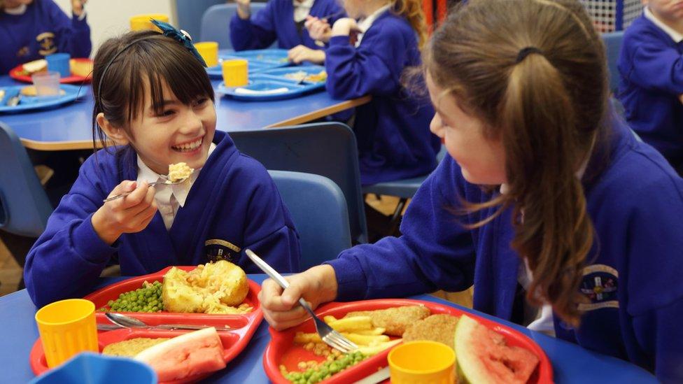 Children eating school dinner