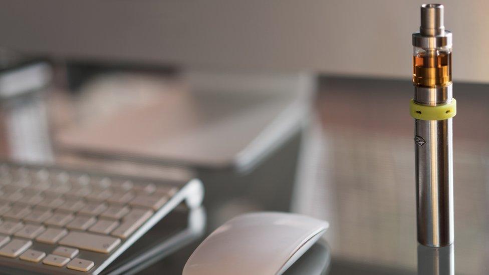 An e-cigarette on an office desk