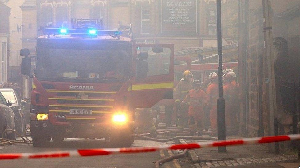 Firefighters at the scene of a fire in Liverpool