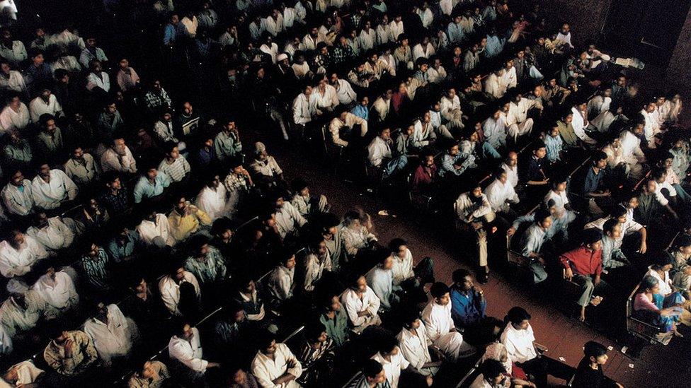 A view from the balcony during a packed sold-out, mid-day show at New Shirin Talkies Cinema January 2002 in Mumbai, India.