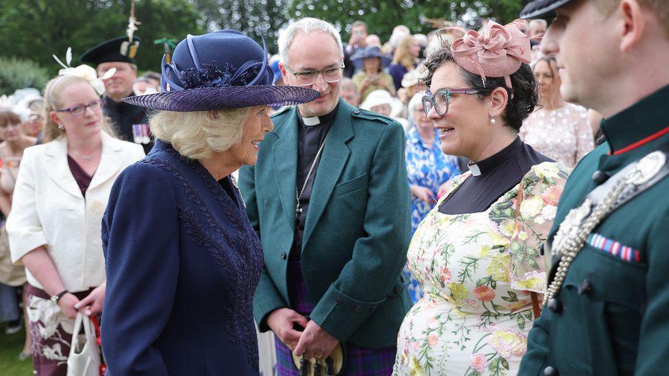 Queen Camilla meeting guests at the Royal garden party.