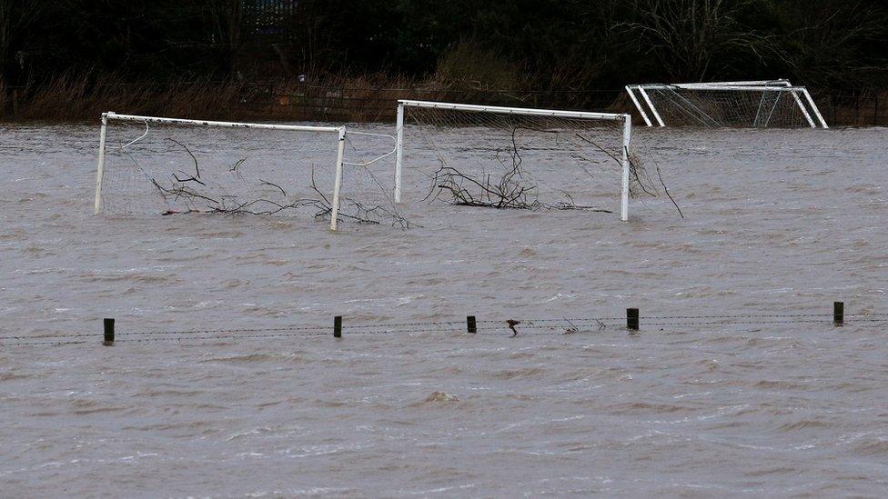 Tree debris was washed away on flooded football pitches in Tadcaster, North Yorkshire