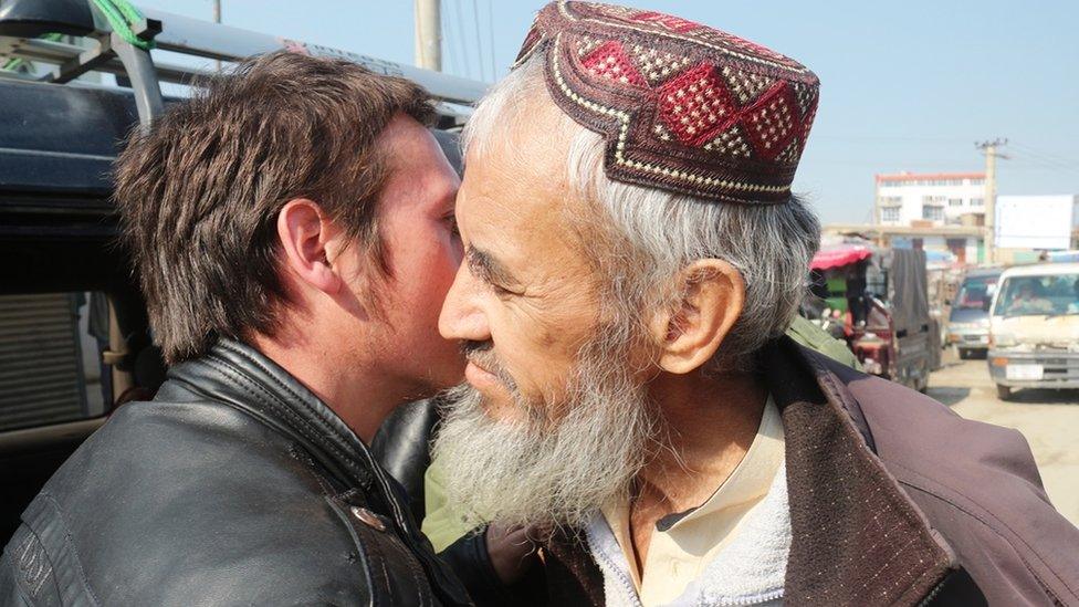 Nabi greets his father after his release