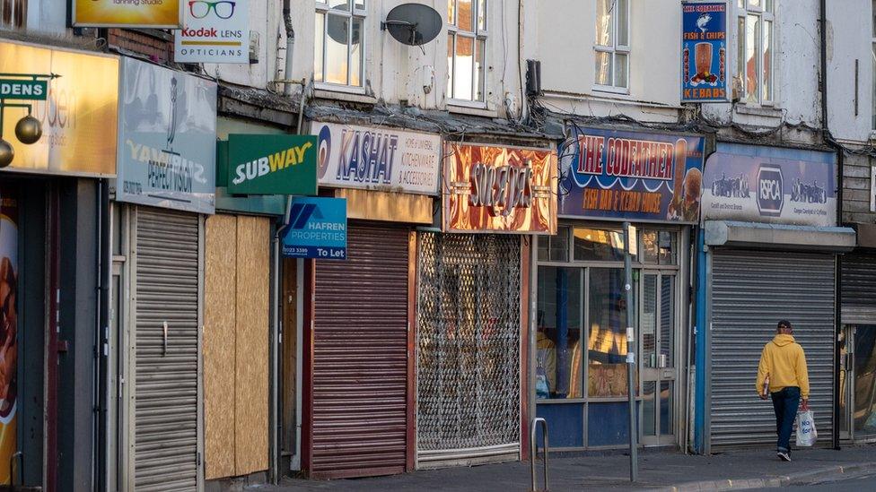 Man walking down a high street