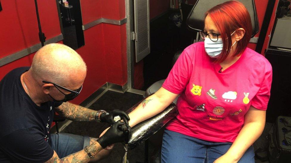 Louise Granger getting a tattoo on her wrist