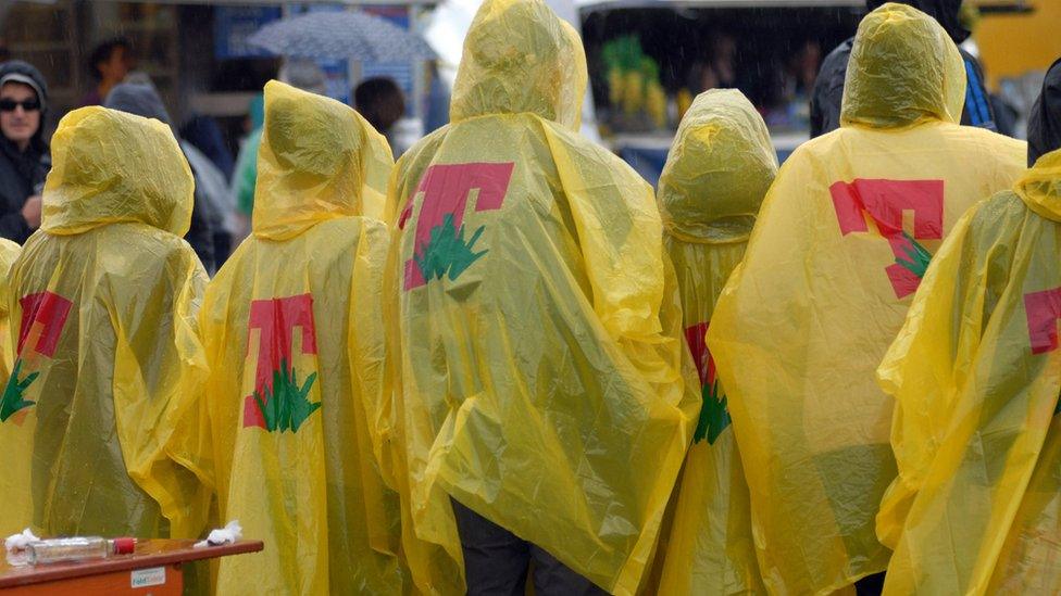 People shelter from the rain at T in the Park