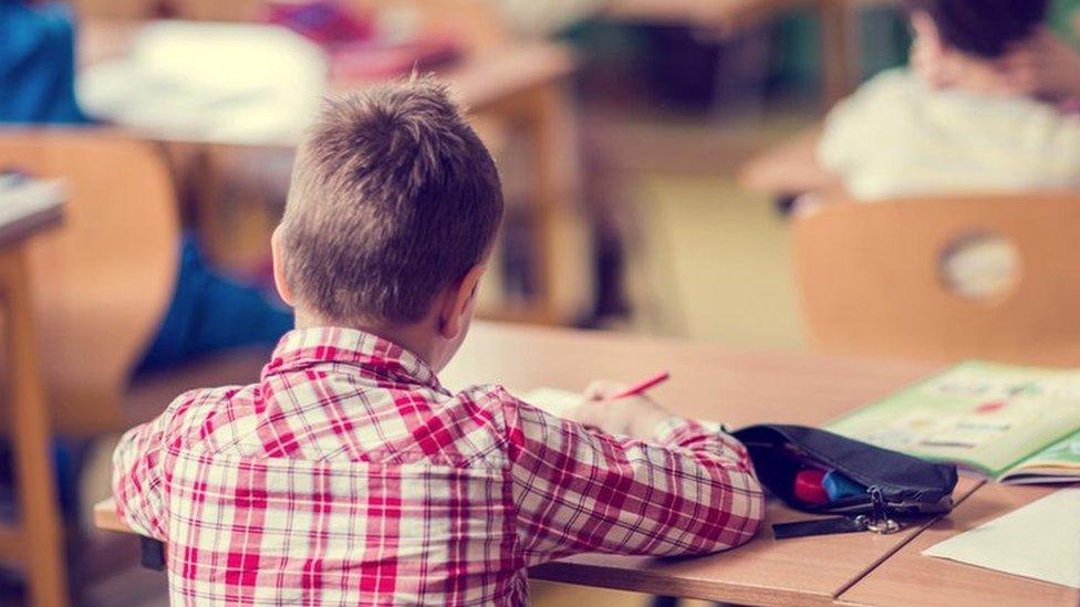 Child sitting in a classroom