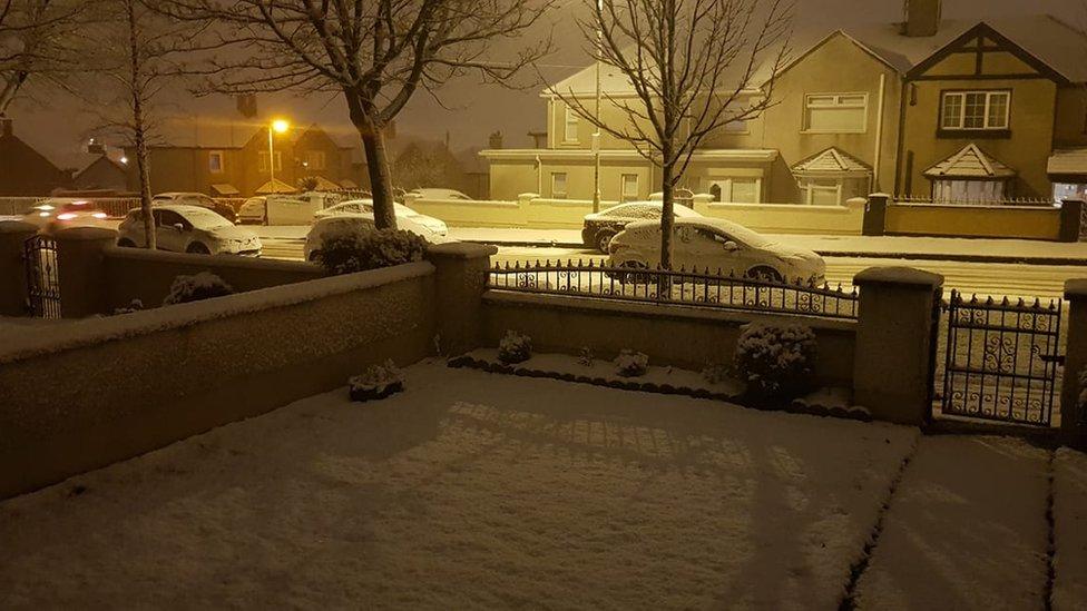 SNOW FALLS ON A HOUSING ESTATE IN DERRY