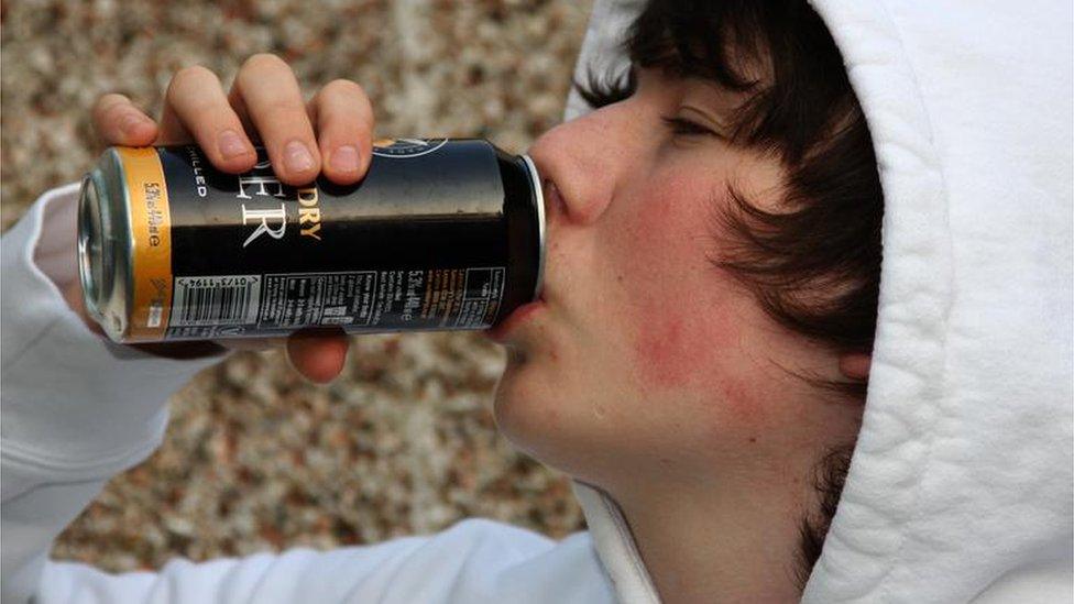 Youth drinking cider