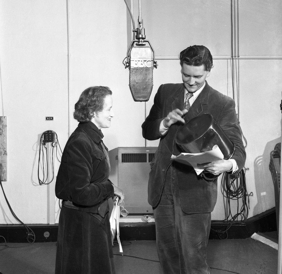 Barbara Burnham, producer, watches Robert Eddison (Lavache) rehearsing with is tabor.