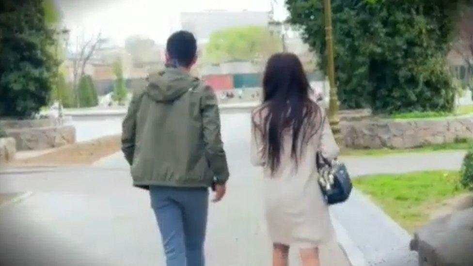 A young couple leaves the park after being confronted by Yashirin Kamera