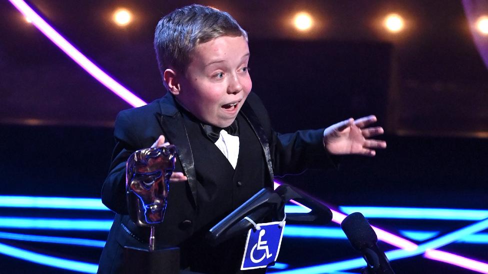 Lenny Rush accepts the Male Performance in a Comedy Programme Award for 'Am I Being Unreasonable?' at the 2023 BAFTA Television Awards with P&O Cruises, held at the Royal Festival Hall on May 14, 2023 in London, England